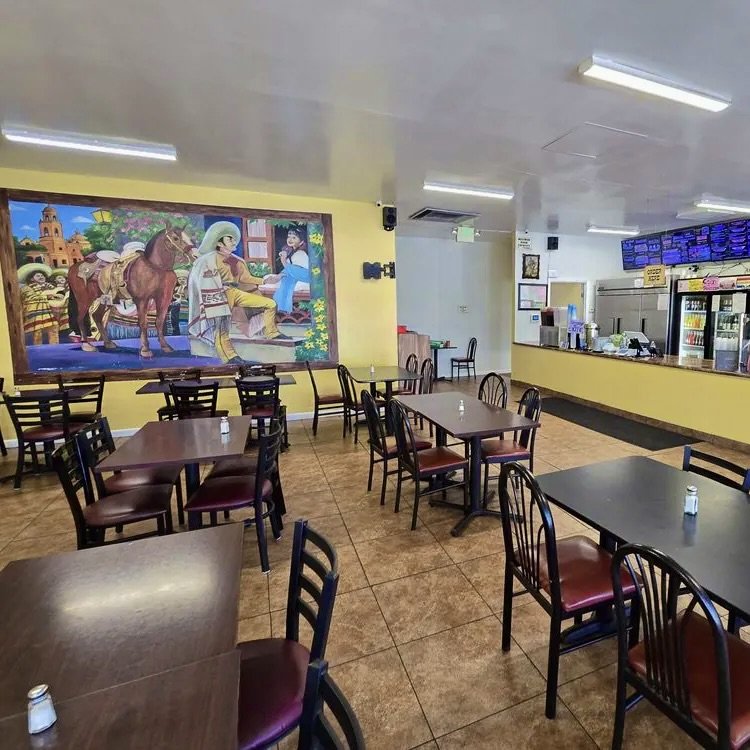 Inside Birria Patro Jaramillo — dining room with mural and Order Here counter on Snell Ave, San Jose